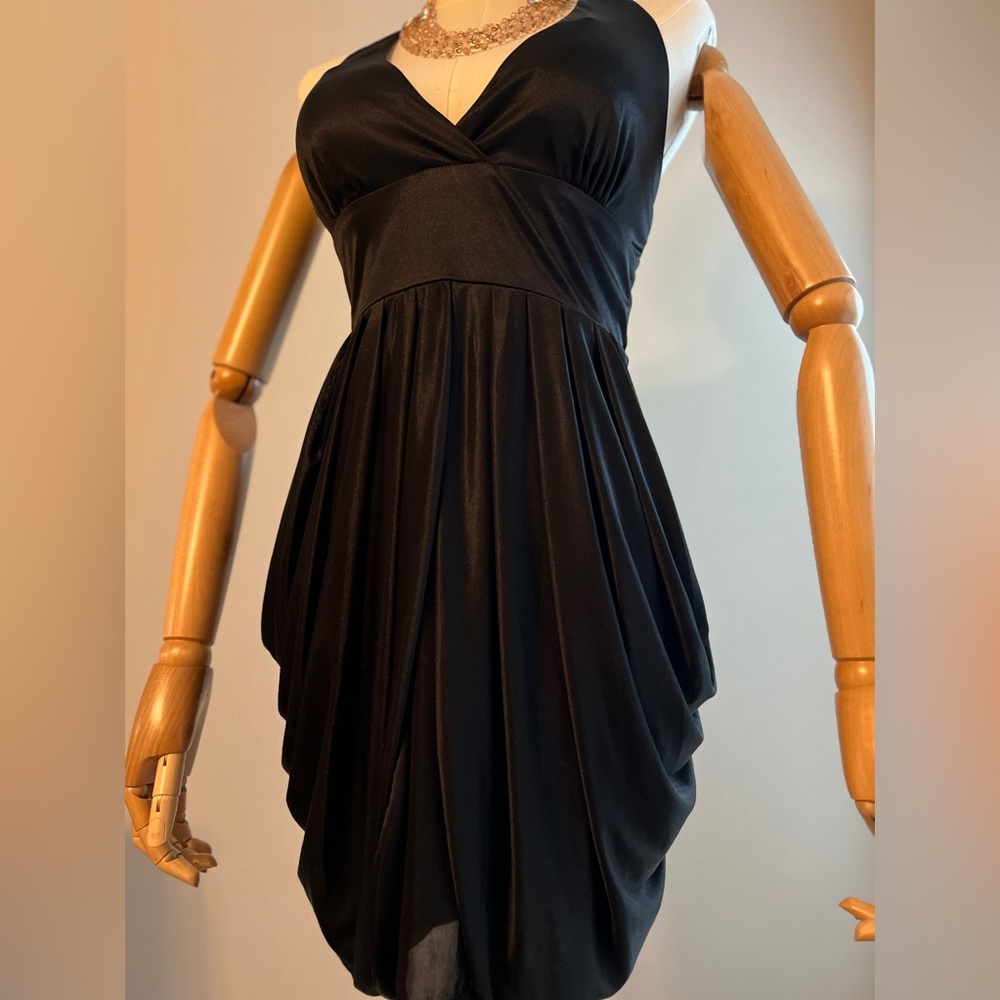Black halter dress with sheer draping a hips. Smoke free pet free worn once.